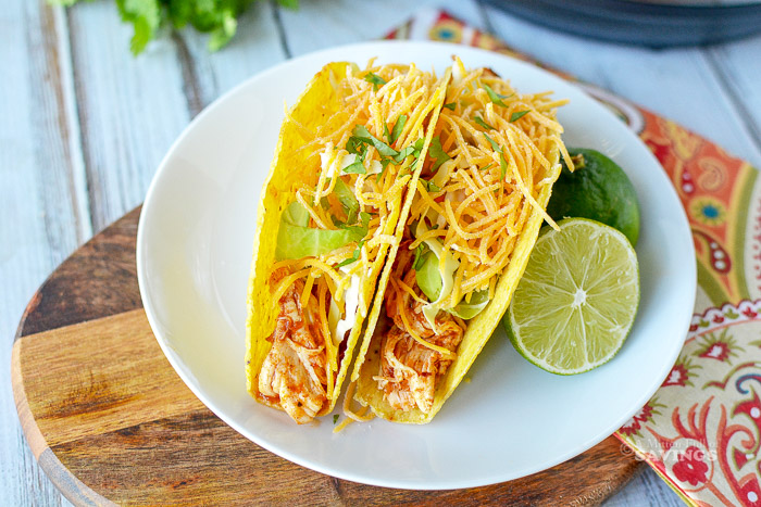 Here's a super easy and delicious Instant Pot Chicken Tacos recipe. This is the ideal way to make dinner for your family in minutes when you don't feel like standing over a stove for hours! Everyone can customize their own taco, and you can hear songs of praise for making a favorite meal.